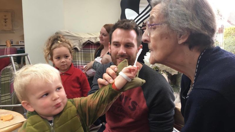 2 year old Indiana blowing bubbles with Hengrove Lodge resident, Brenda 