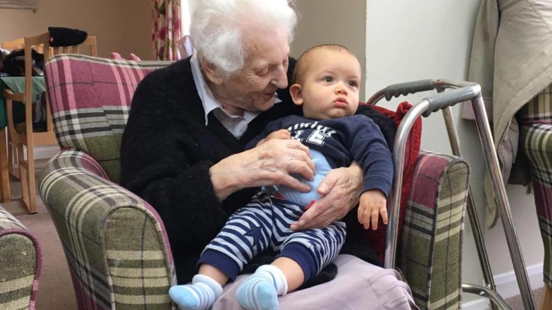 Dot Whittingham and young Charlie enjoying a cuddle