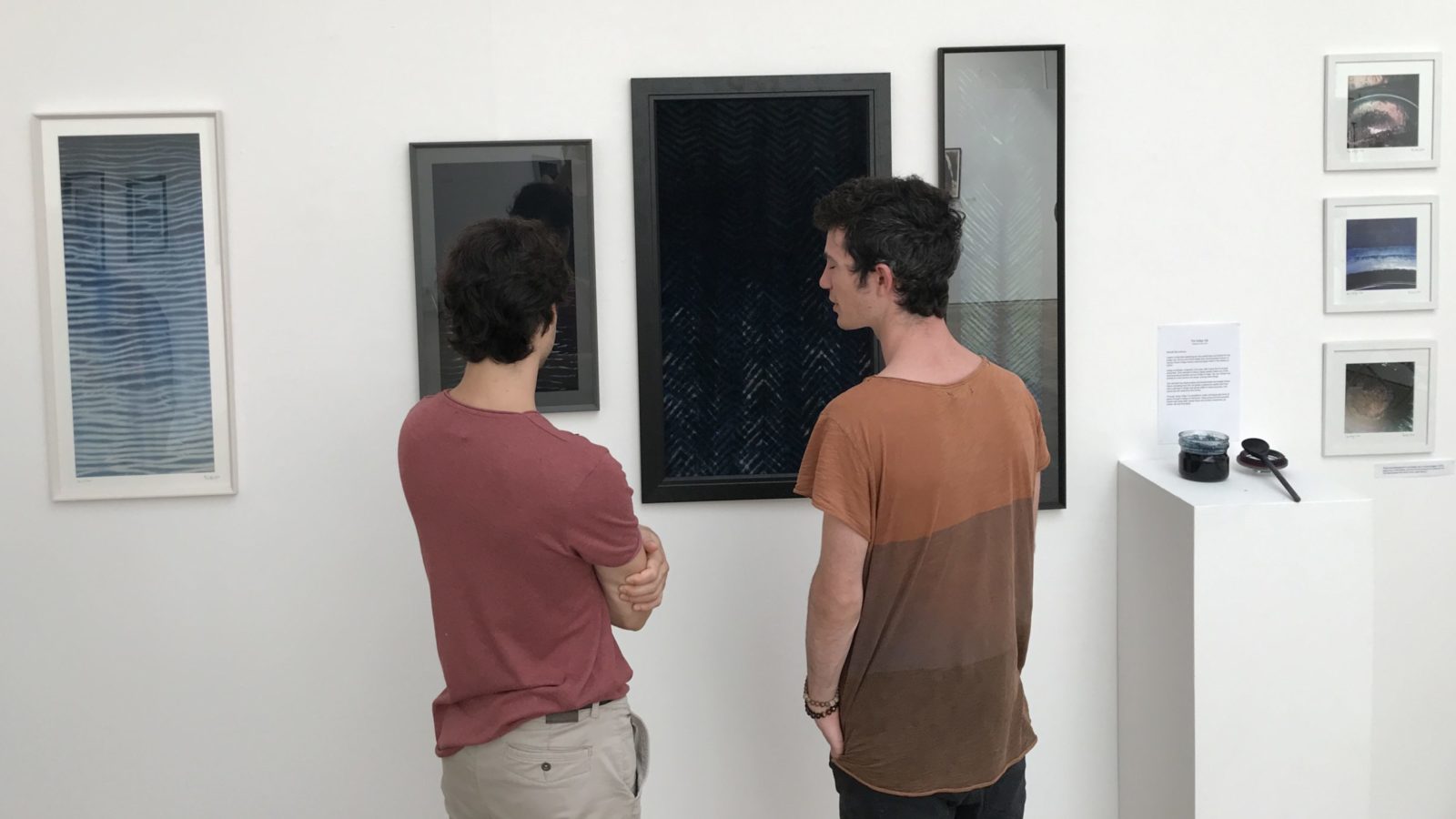 Two people looking at artwork