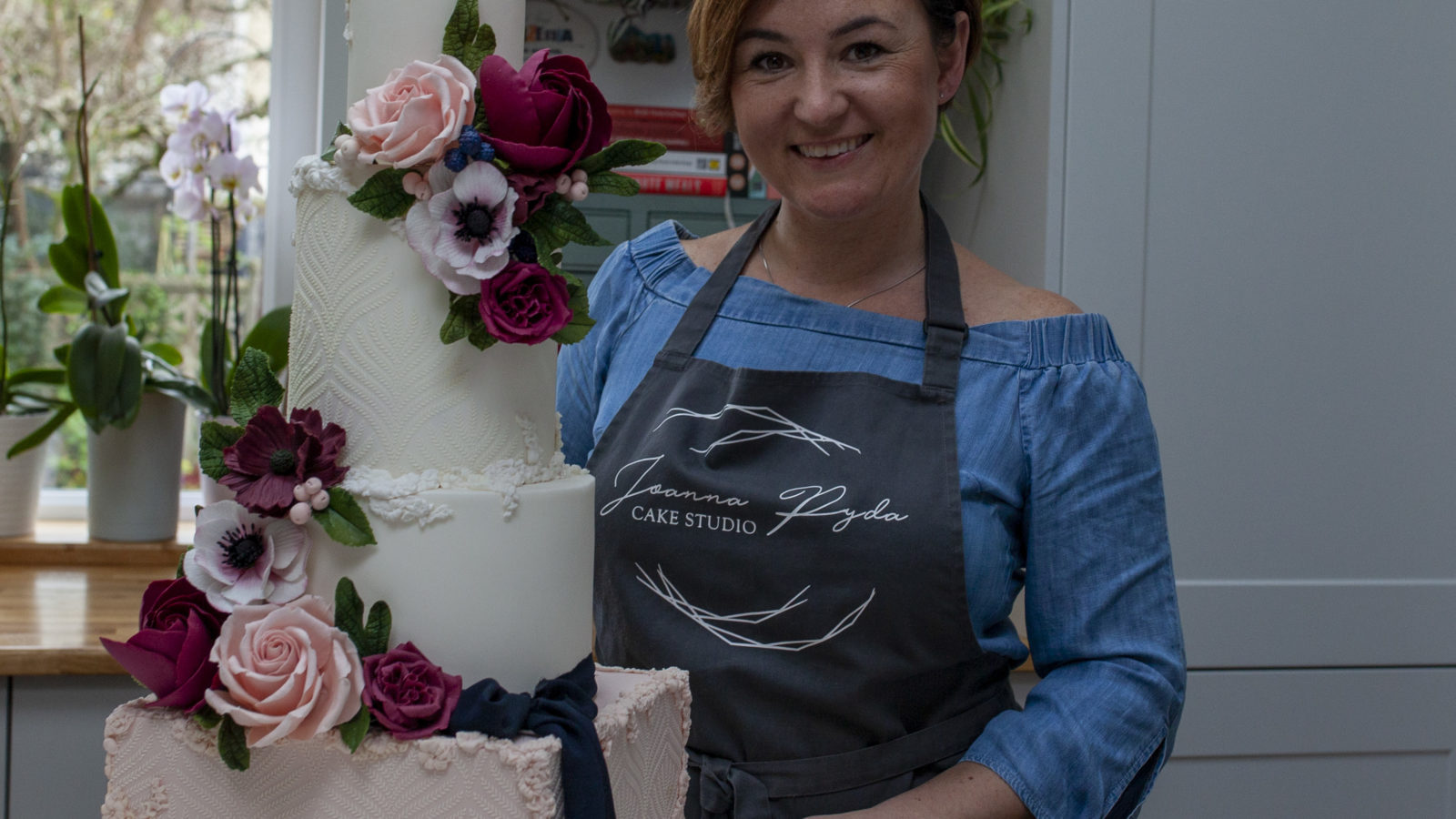 Women with a cake structure at Bristol24/7