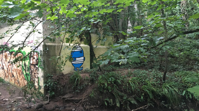 Mr Bump painted overlooking a river