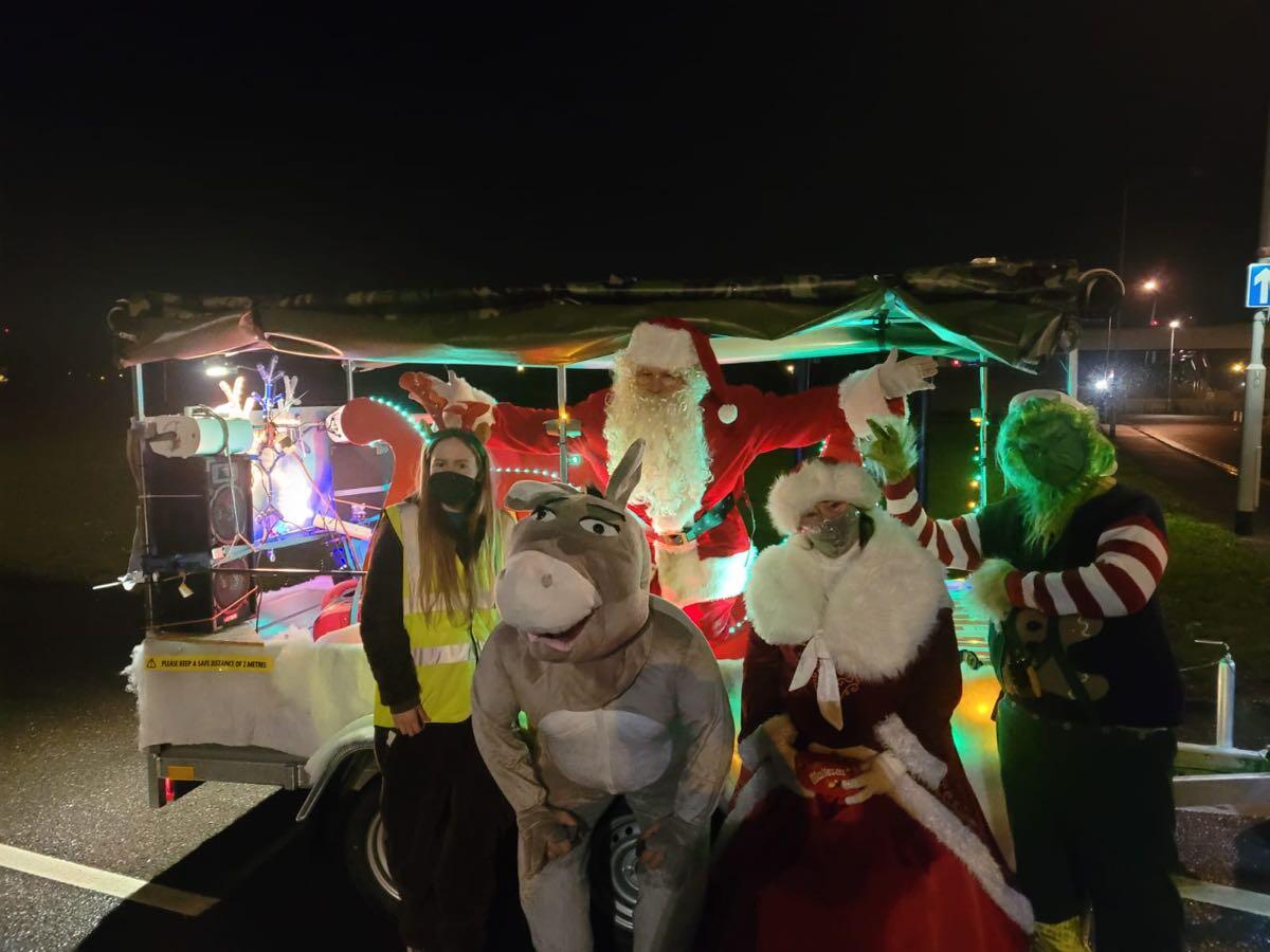 Santa and characters around a sleigh