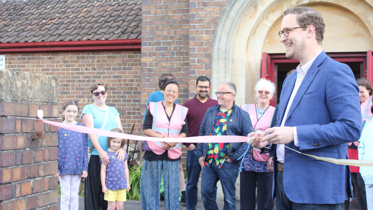 Darren Jones sews a ribbon together