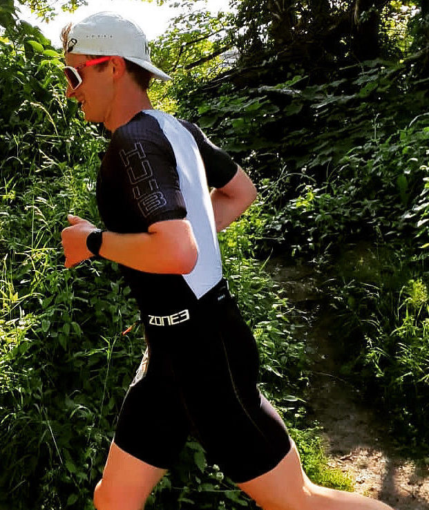 A man runs in a triathlon.