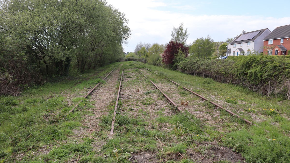 Railway tracks can be seen in the mud and grass looking towards Portishead