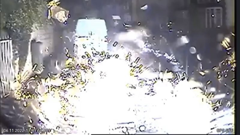A screenshot of dashcam footage of a firework exploding on an ambulance