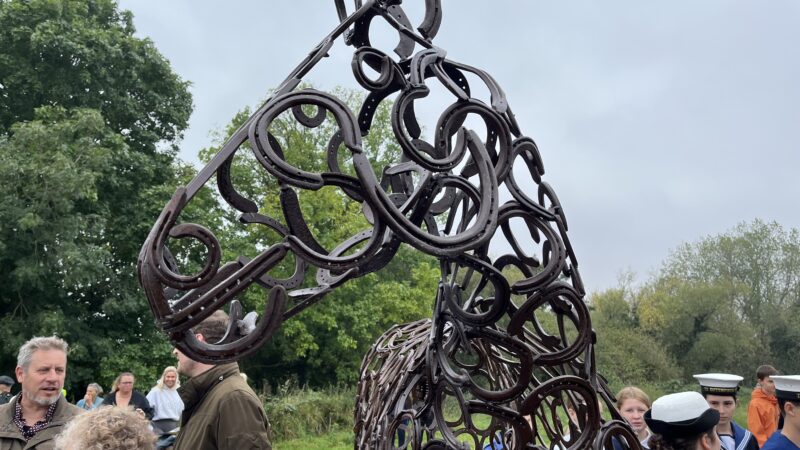 A horses head formed from horse shoes