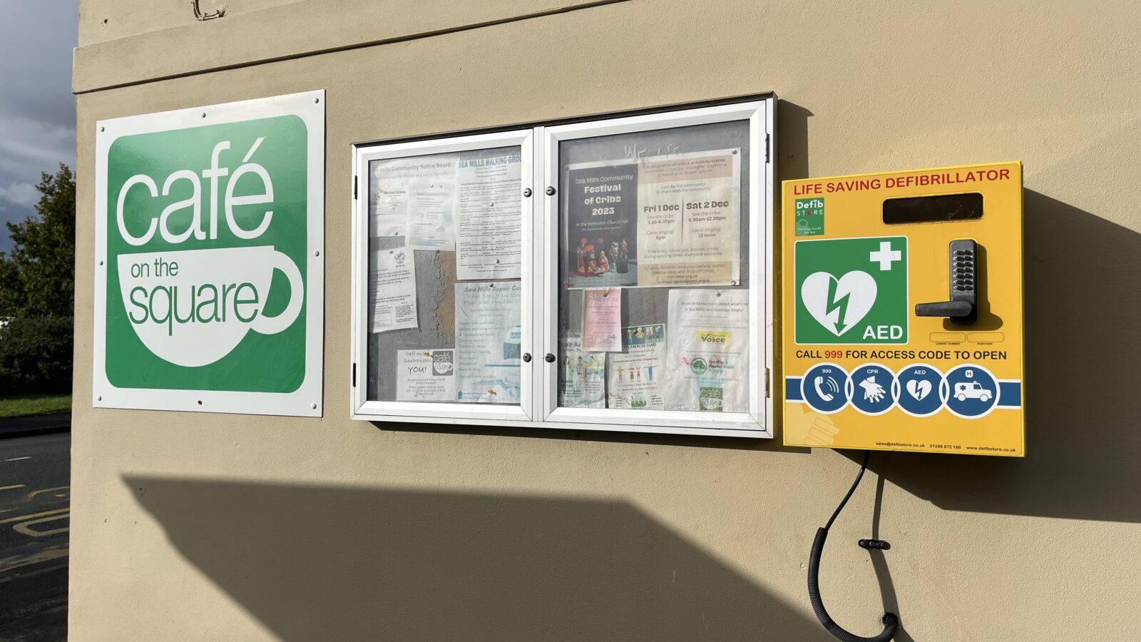 Defibrillator box on the side of a cafe