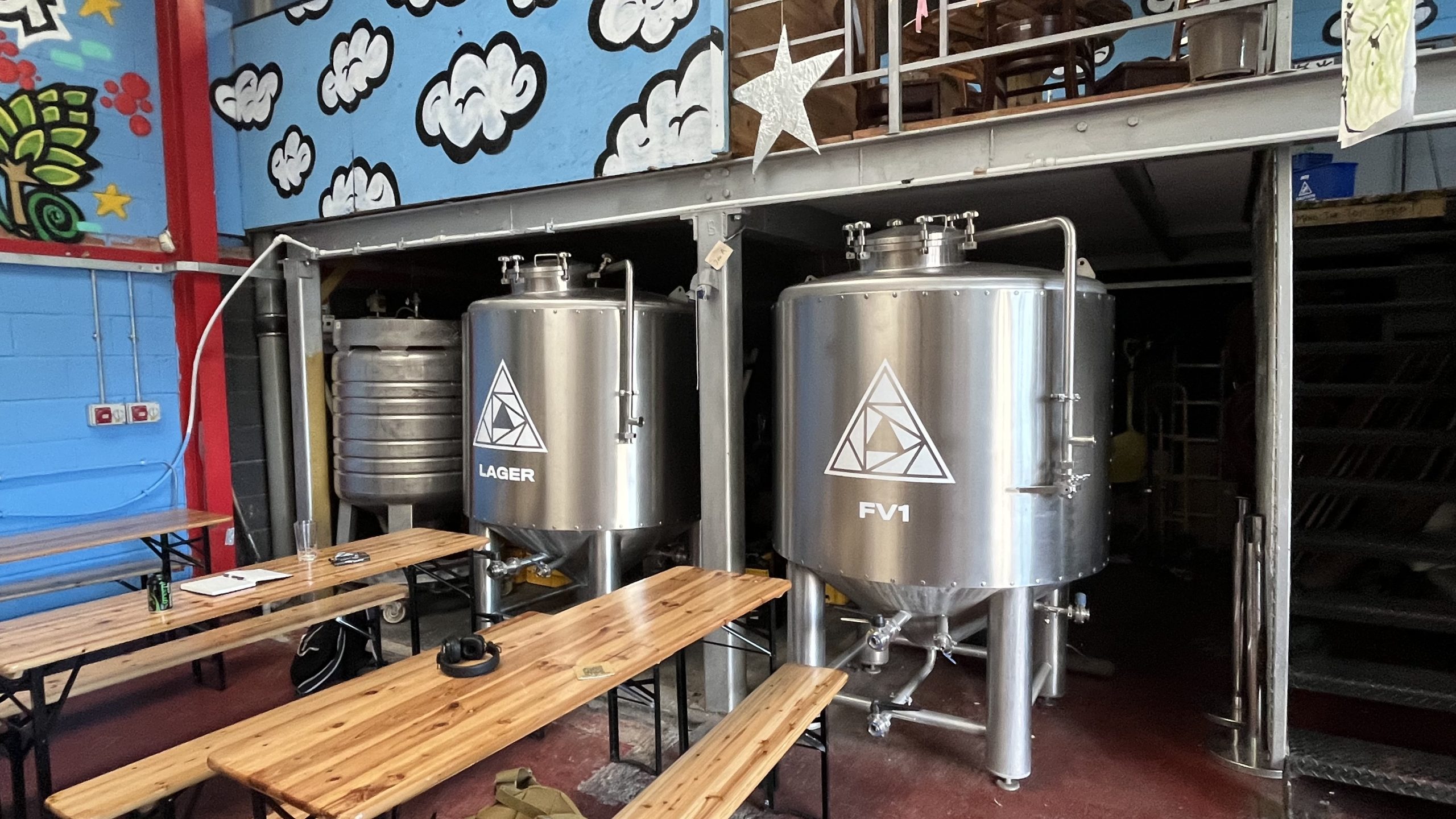 two large industrial brewing tanks