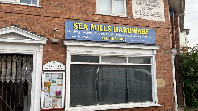 An empty shop with a old sign for Sea Mills Hardware