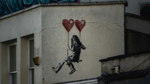 Banksy graffiti with child on swing with balloons (Credit University of Bristol)
