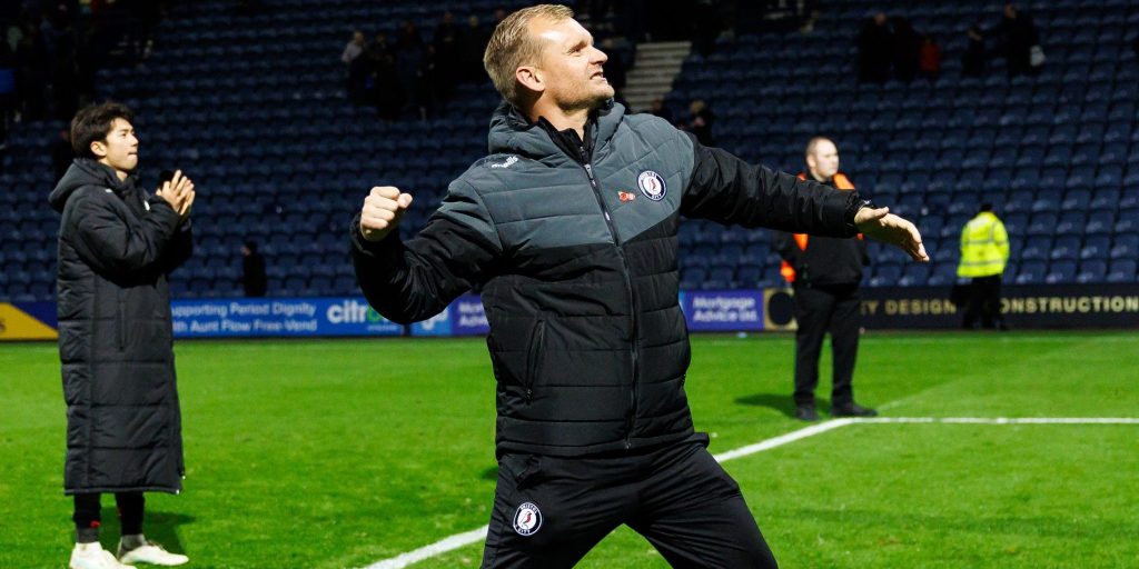 Liam Manning punches the air after a 3-1 win over Preston in November.