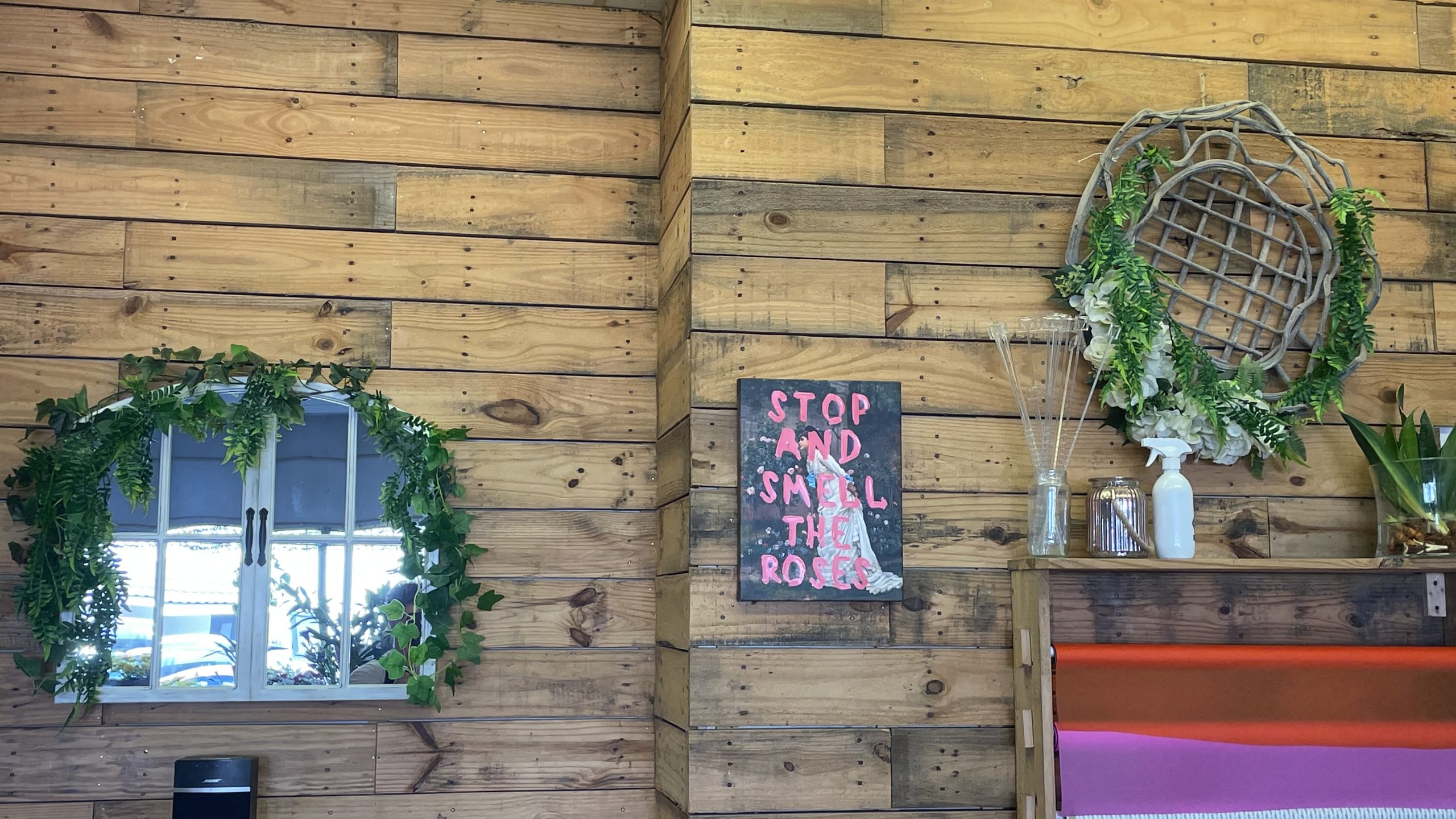 Decorative wreaths and wall sign at Don Gay’s Florist – photo Alex Cavanagh