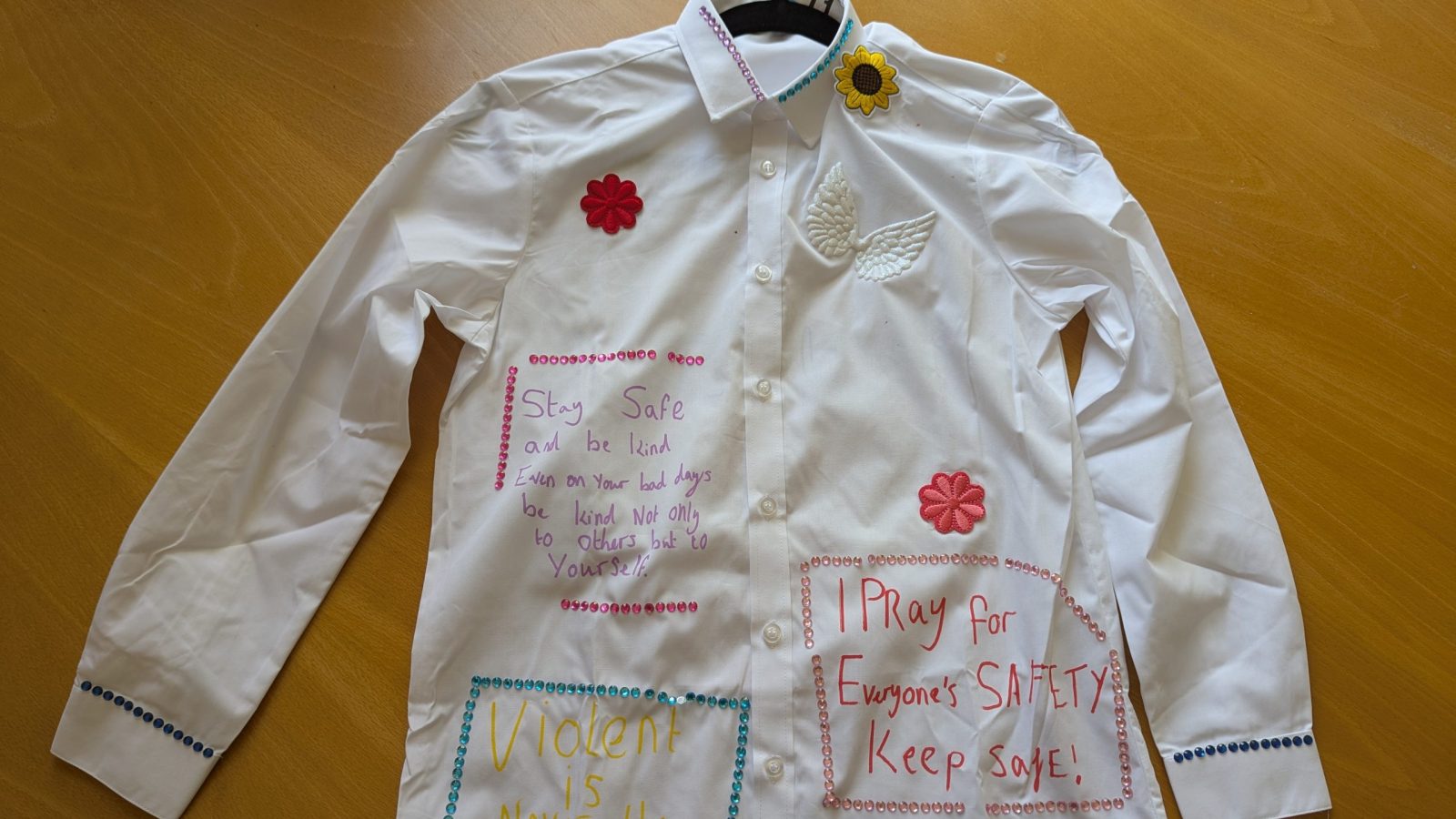 School uniform scribbled on with messages from children and young people (Image: University of Bristol)