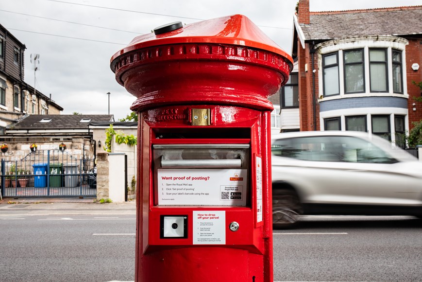A post box with a barcode scanner and solar panels on top