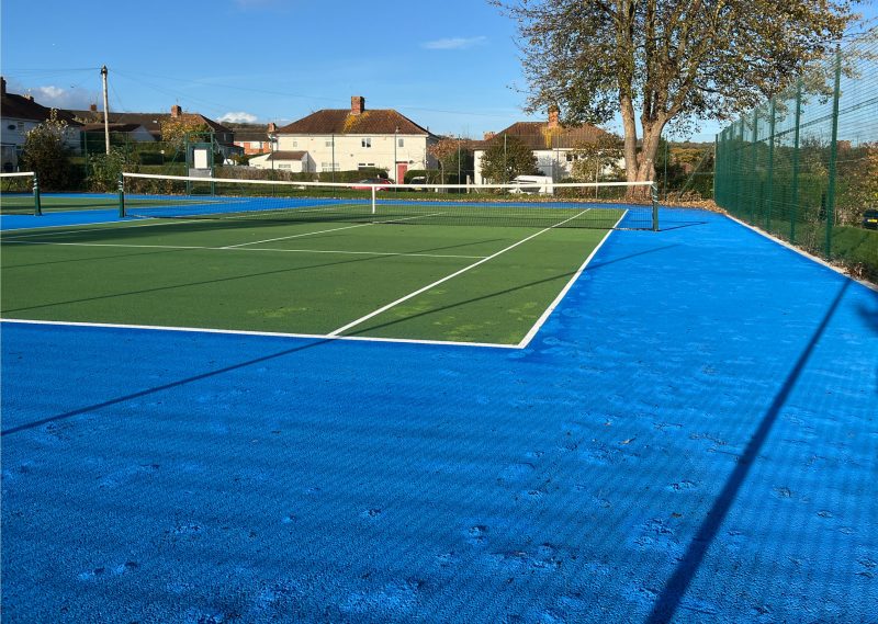 Repairs to Dingle Close tennis courts with marks where weeds have been removed
