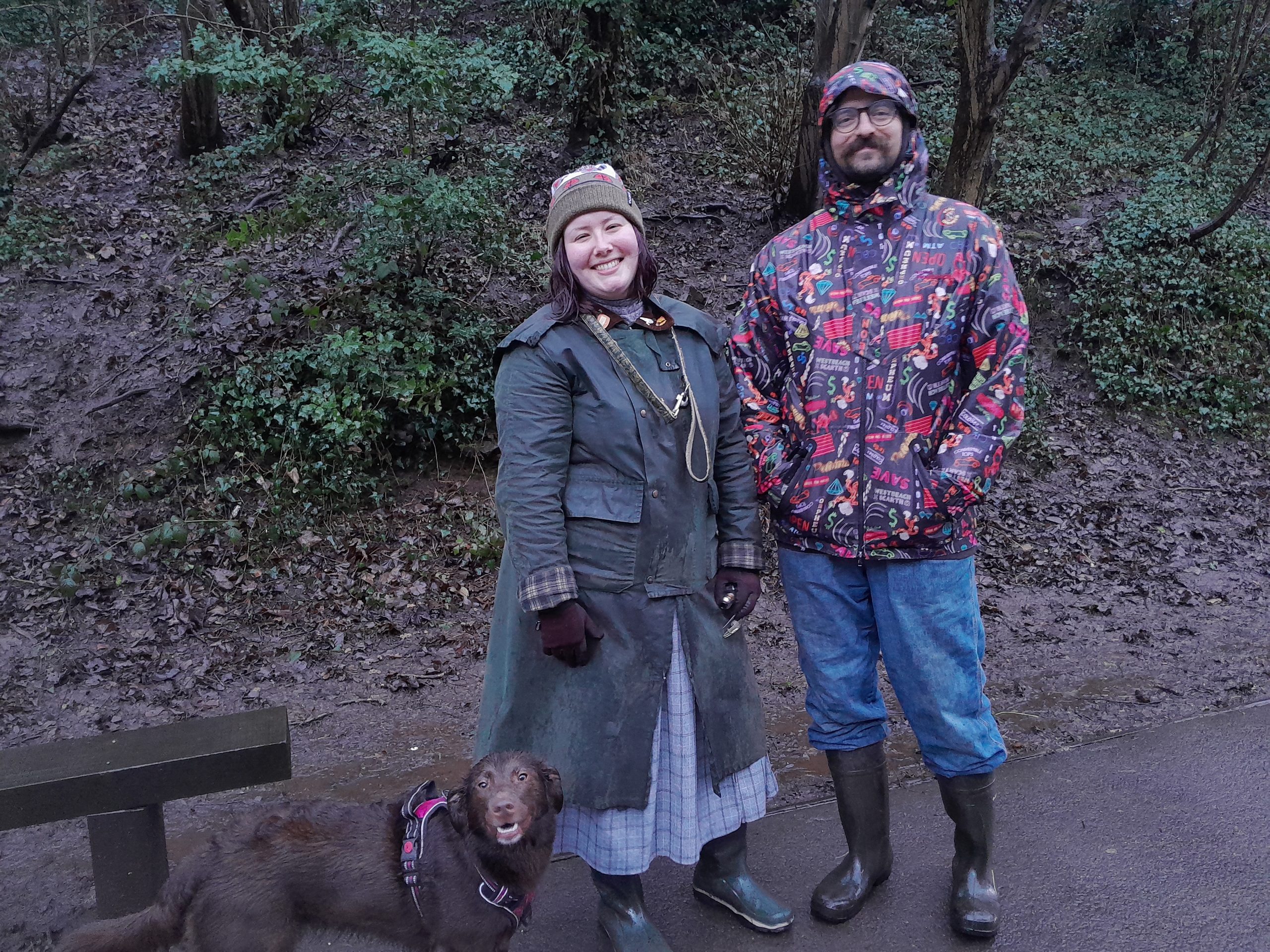A smiling couple with their dog in Eastville Park