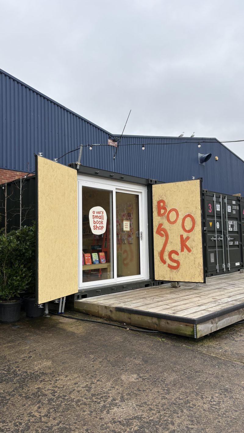 Books written in a wiggly font, invites passersby to the new shop in Bedminster
