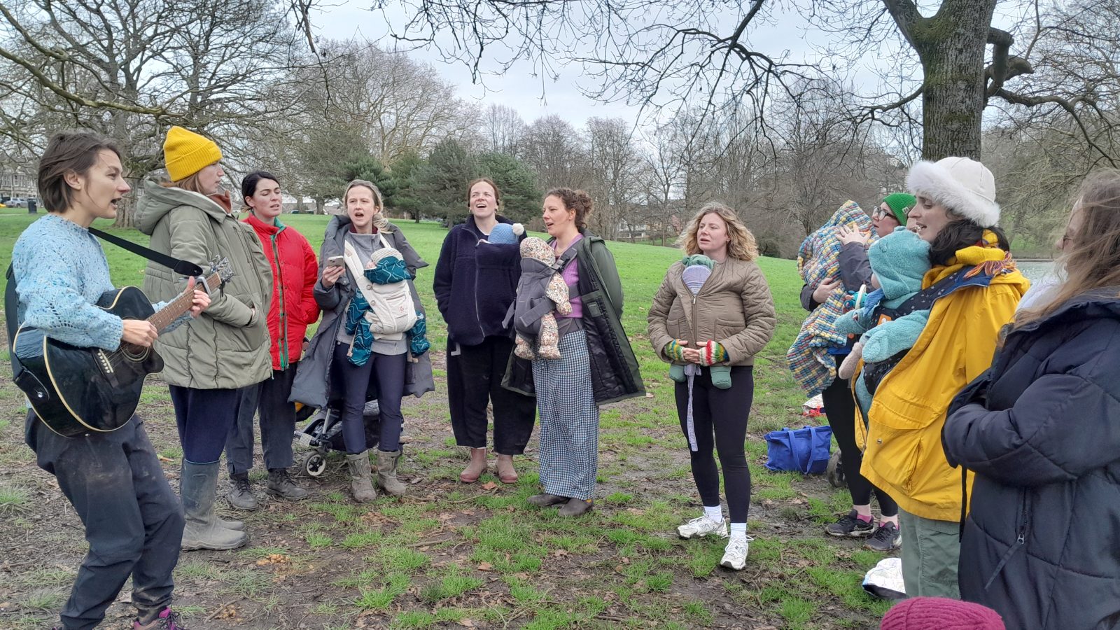 Bring Your Own Baby choir practice in park