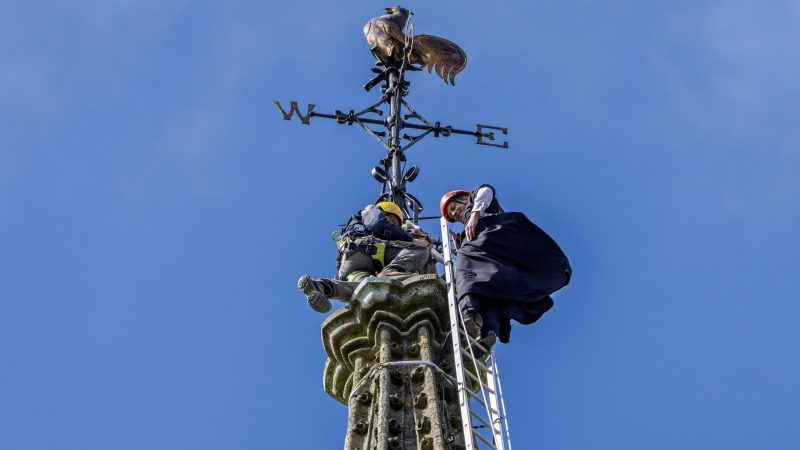 Vicar scales historic church spire to support solar panel project