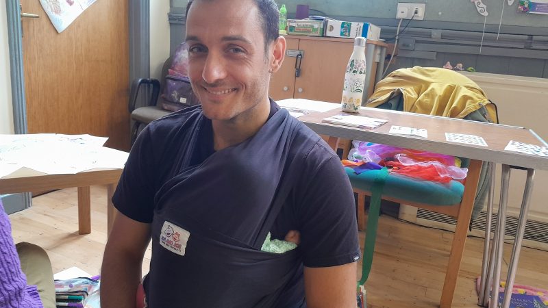Christos Paschalidis with his baby at the Coexist Open Day event in St George